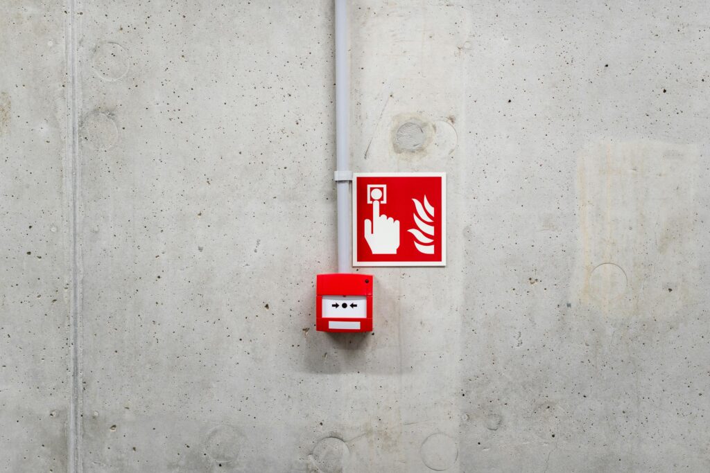 Fire Alarm Button on a Gray Wall